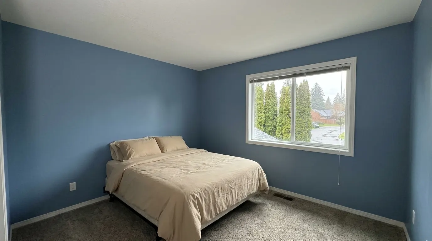 Same bedroom with rebuilt ceiling after storm damage restoration